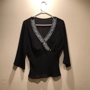 Beautiful sheer blouse with beaded neckline